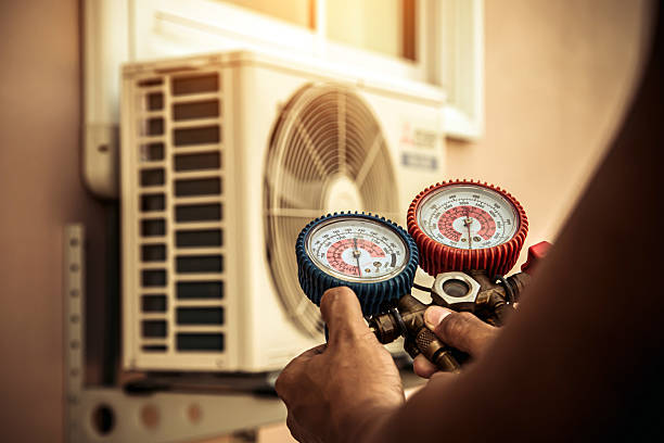 Professional Heat Pump Repair technician working in Buda, TX